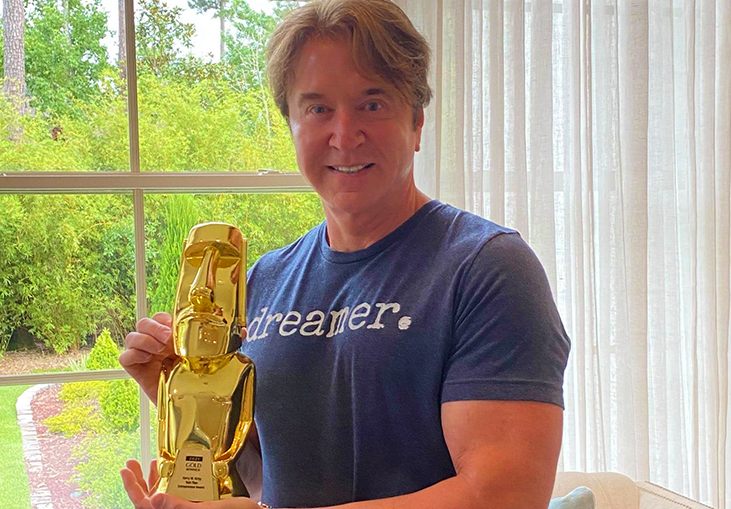Kerry W. Kirby shares his sturdy Gold TITAN Awards Statuette on his Facebook!