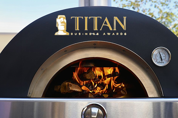 Coyote Outdoor Living celebrating National Pizza Month with another award for their Hybrid Multi-Fuel Pizza Oven!